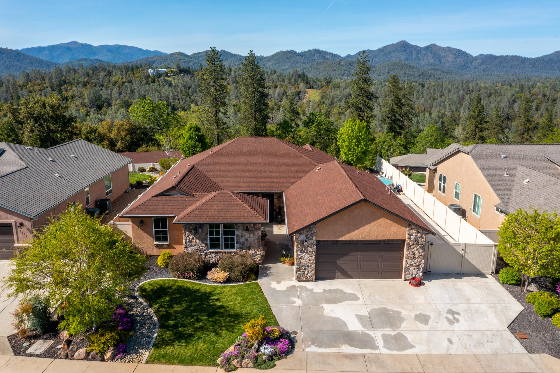an aerial view of a house with a garden