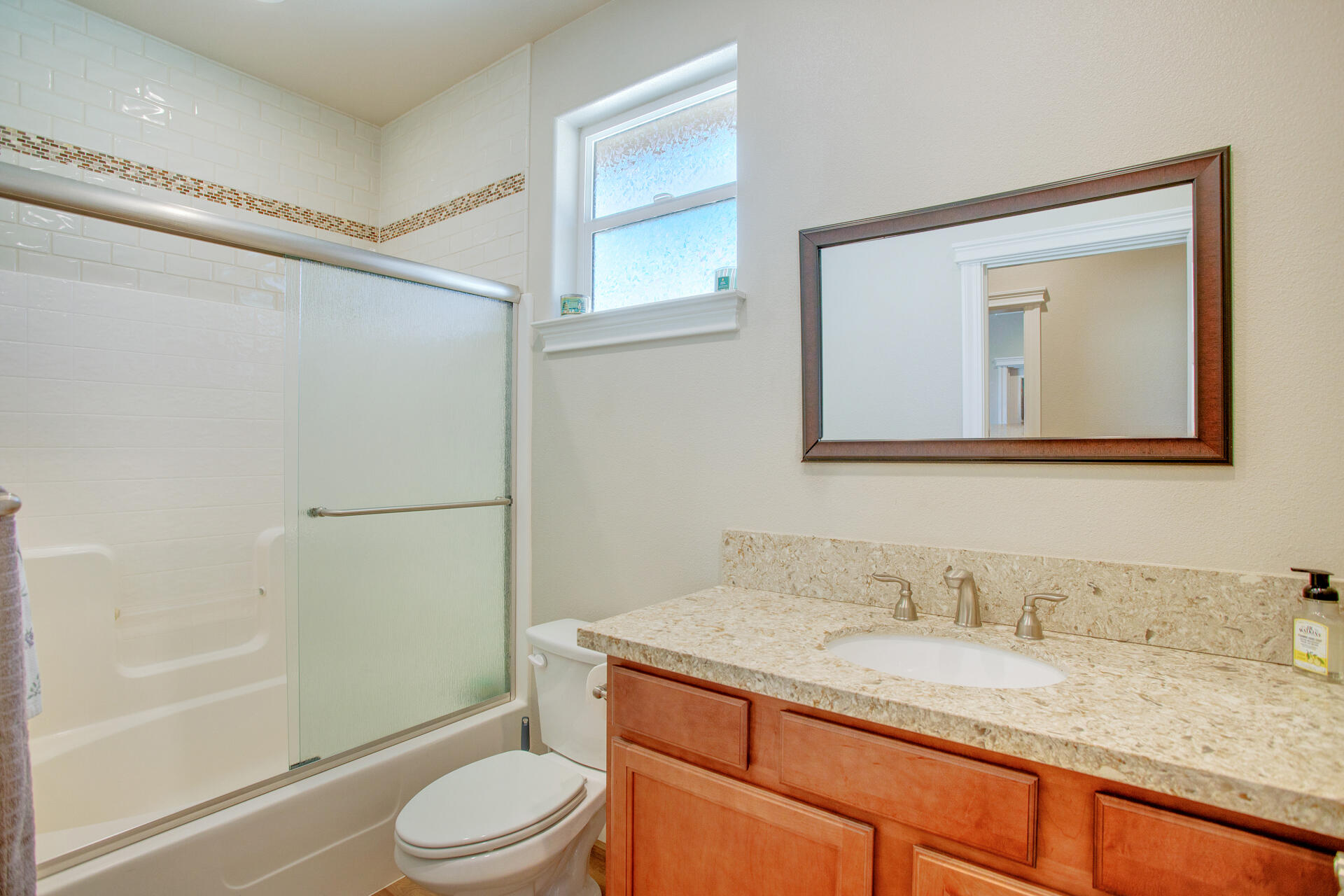 4321 Risstay Way Shasta Lake, CA 96019 - Photo 17 of 38 a bathroom with a granite countertop sink toilet and shower