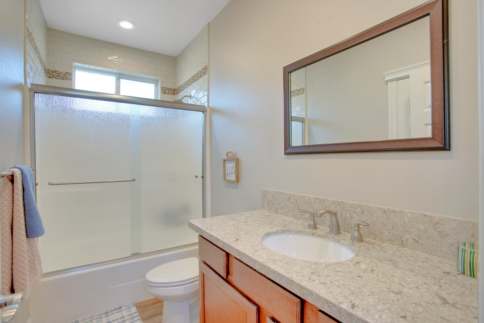 4321 Risstay Way Shasta Lake, CA 96019 - Photo 19 of 38 a bathroom with a granite countertop sink a toilet and a mirror