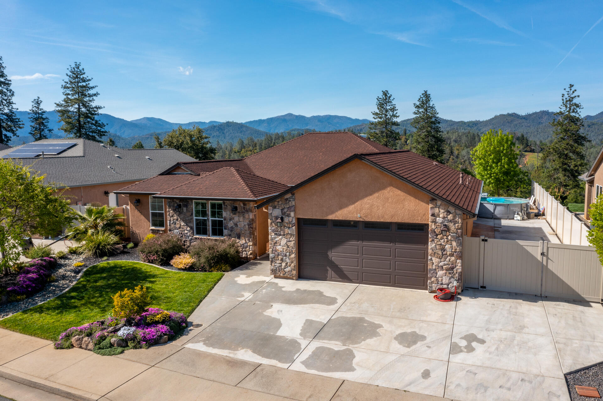 4321 Risstay Way Shasta Lake, CA 96019 - Photo 2 of 38 a front view of a house with a yard and garage