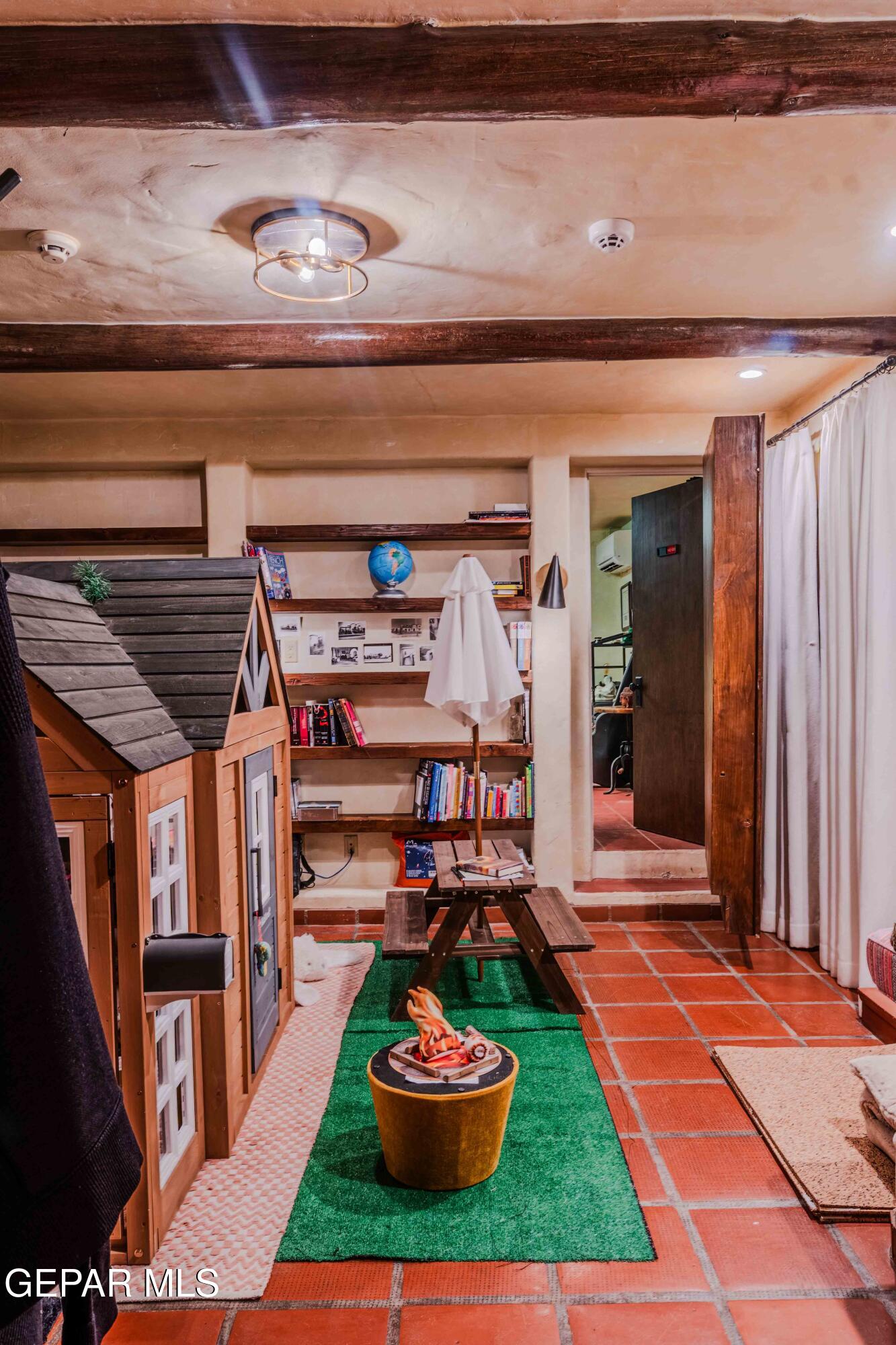701 Rim Road El Paso, TX 79968 - Photo 12 of 54 a living room with furniture and a fireplace