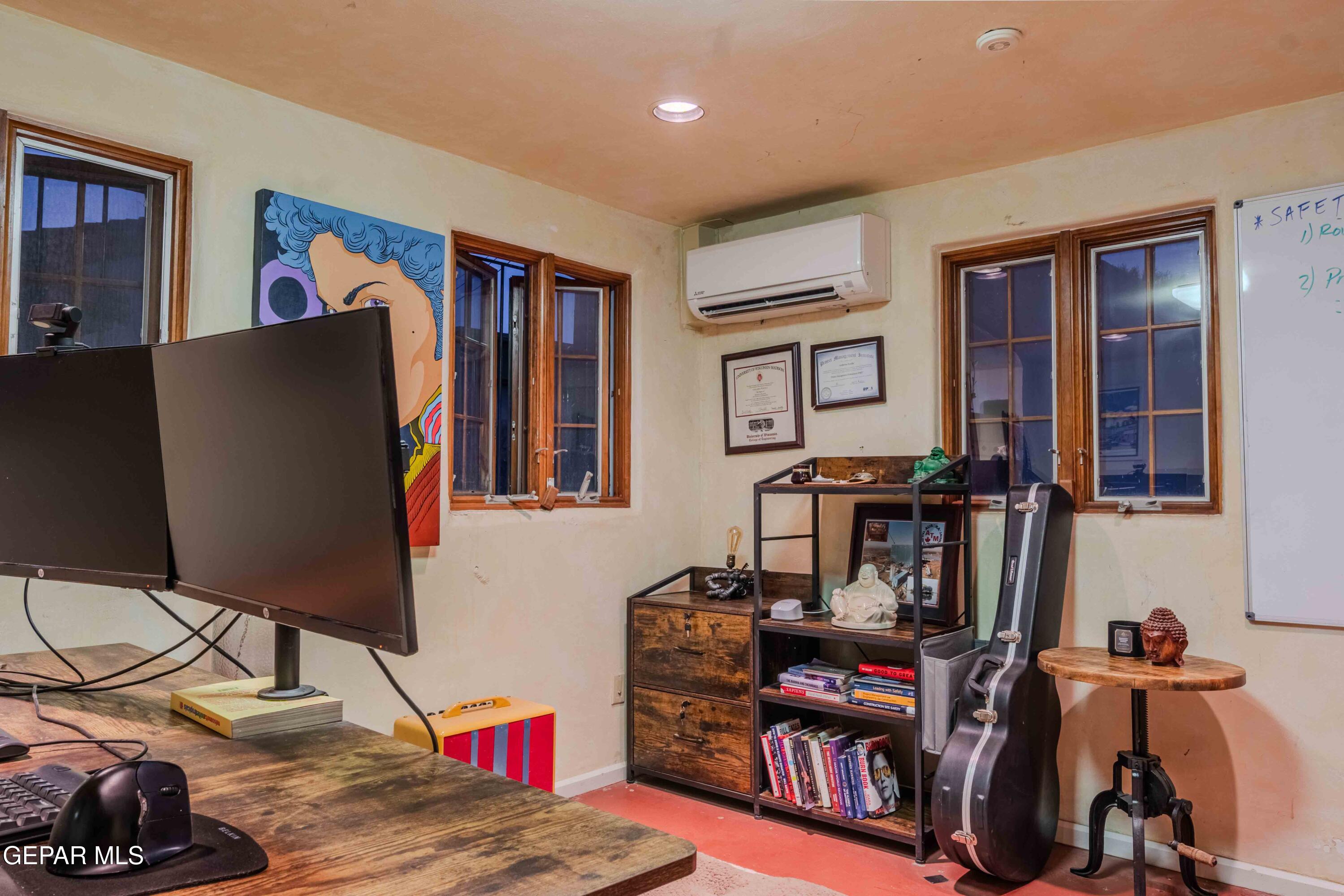 701 Rim Road El Paso, TX 79968 - Photo 13 of 54 a living room with furniture and a flat screen tv
