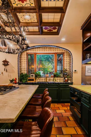 a kitchen with stainless steel appliances granite countertop a stove and a sink