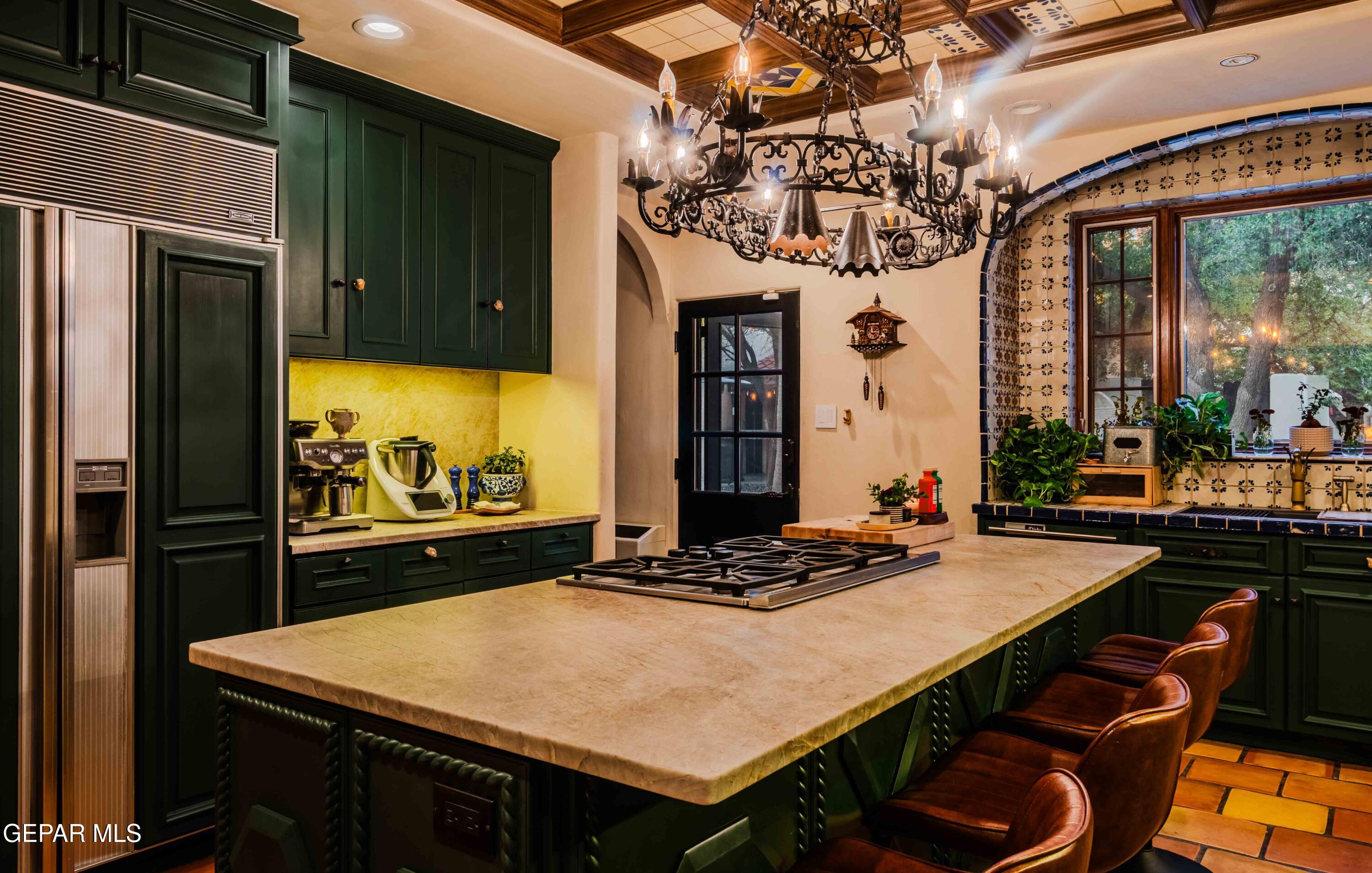 701 Rim Road El Paso, TX 79968 - Photo 16 of 54 a room with a table chairs and a chandelier