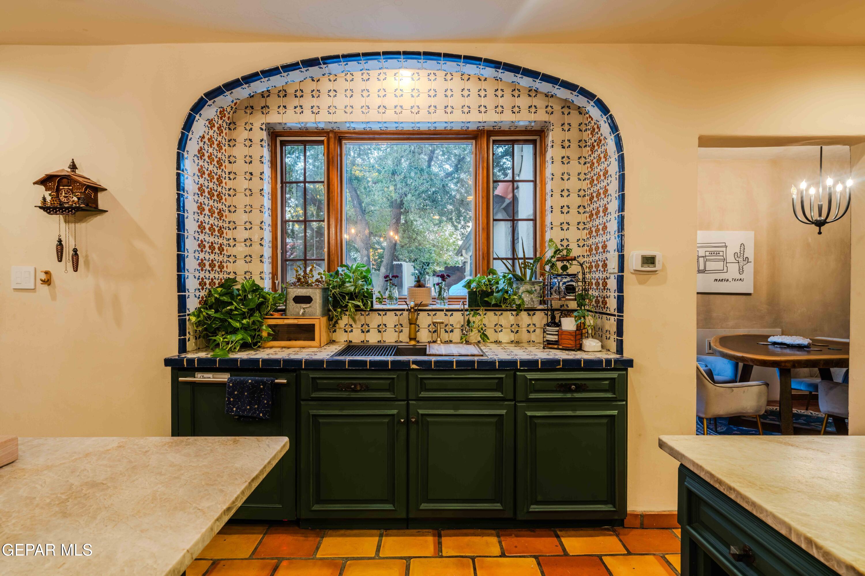 701 Rim Road El Paso, TX 79968 - Photo 19 of 54 a kitchen with a sink and large windows