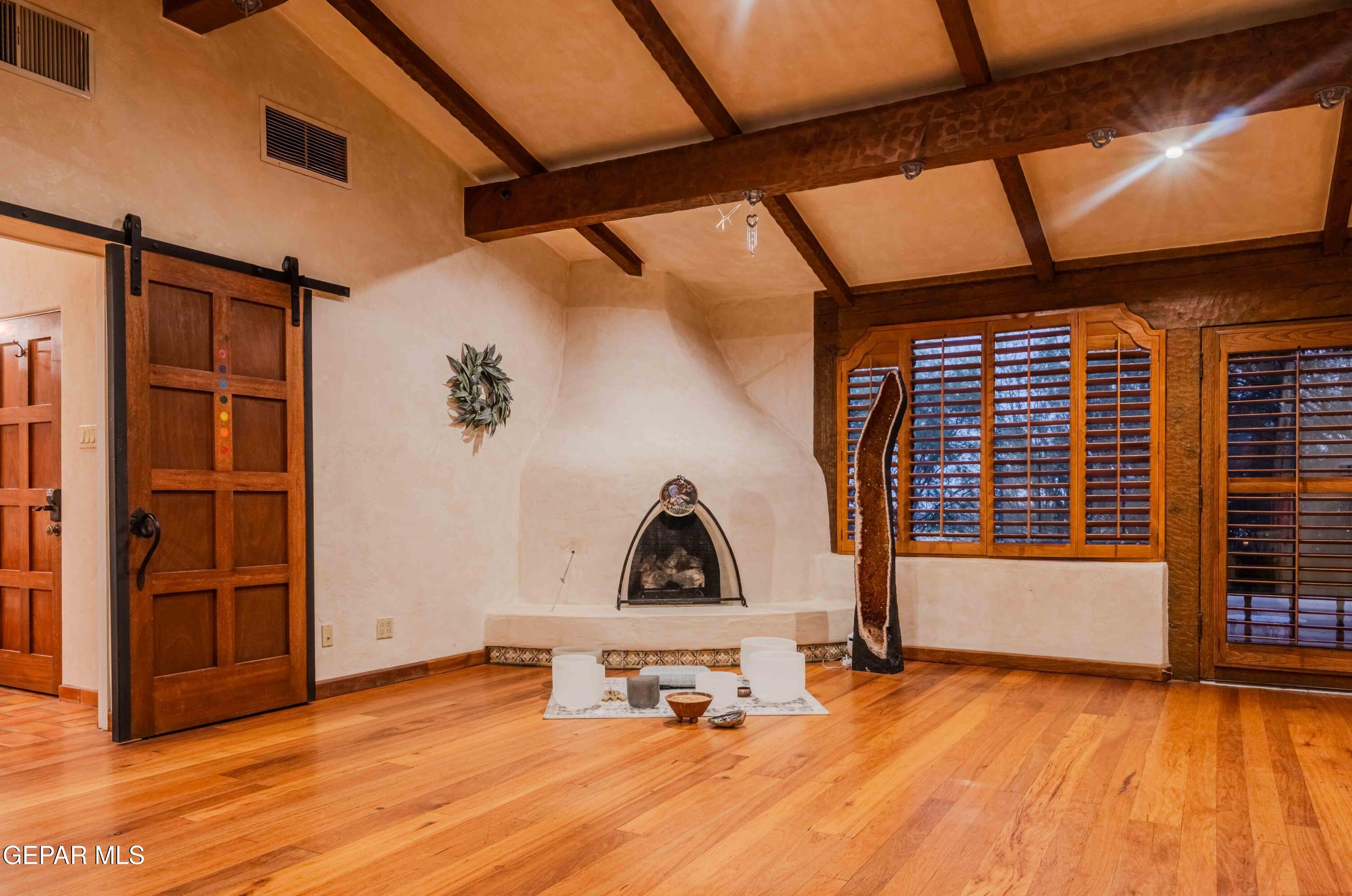 701 Rim Road El Paso, TX 79968 - Photo 25 of 54 a view of a room with wooden floor and windows