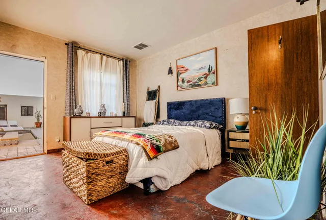 a bathroom with a toilet a sink and a shower curtain