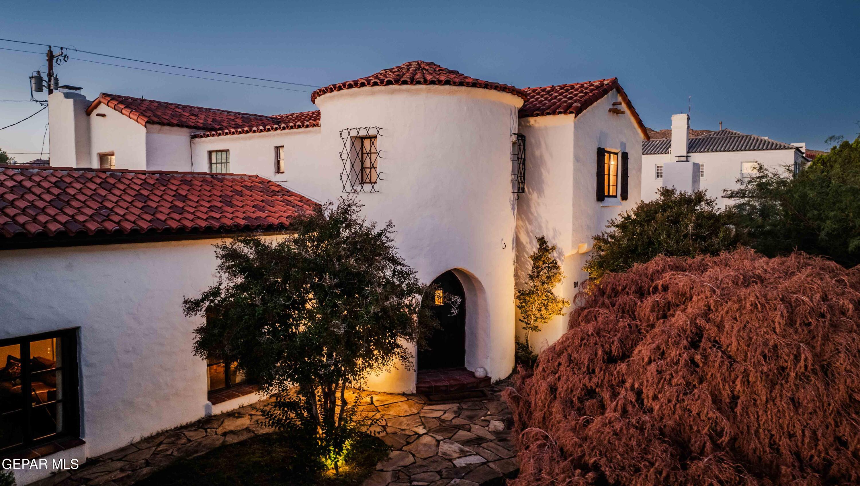 701 Rim Road El Paso, TX 79968 - Photo 4 of 54 a view of a house with a yard and plants