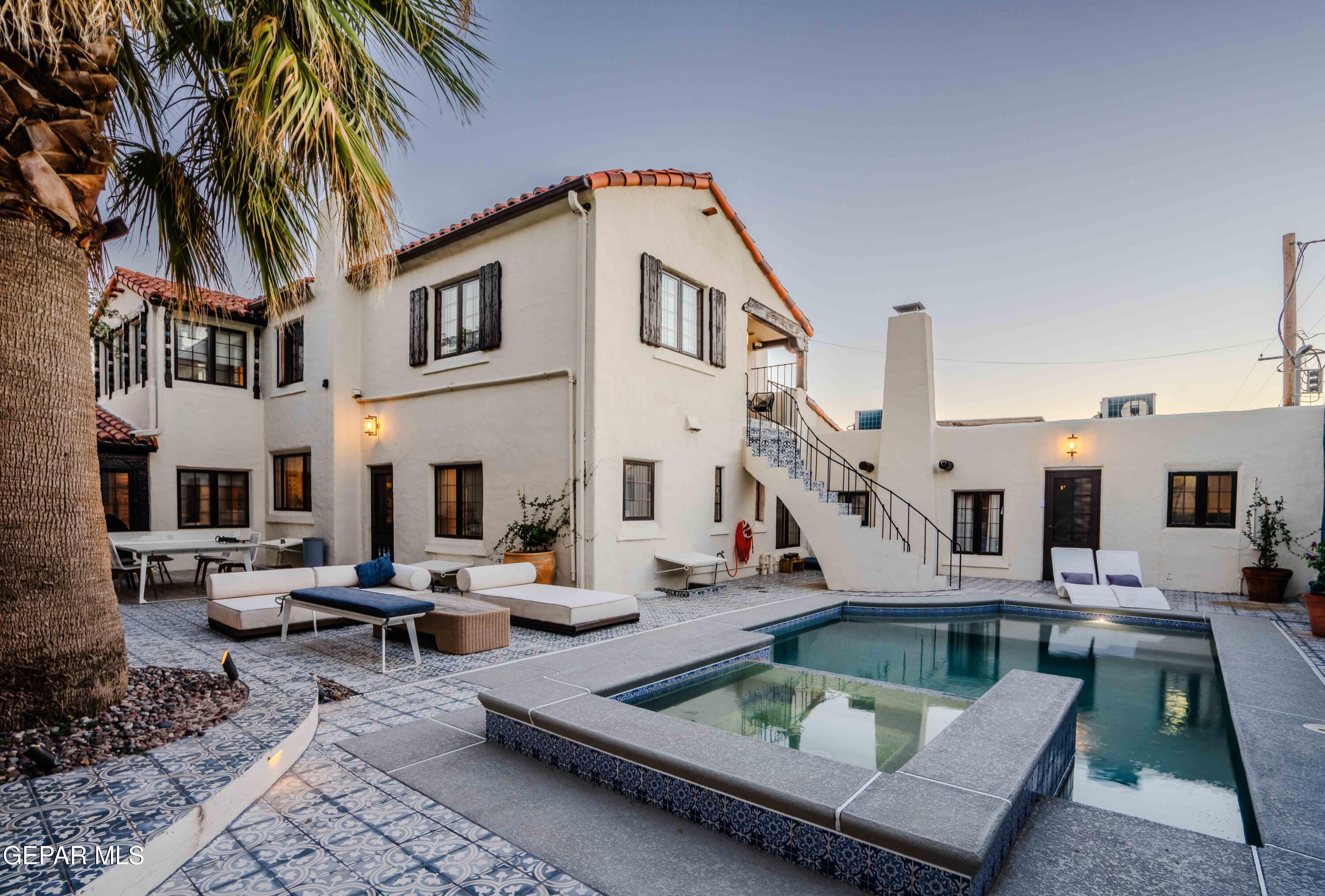701 Rim Road El Paso, TX 79968 - Photo 47 of 54 a view of a house with backyard water fountain and sitting area