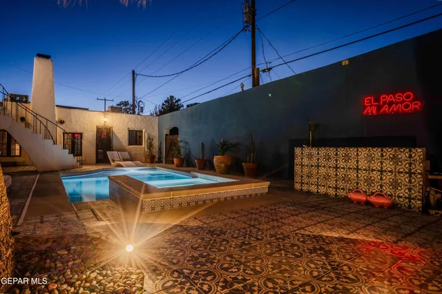 a view of a patio with swimming pool