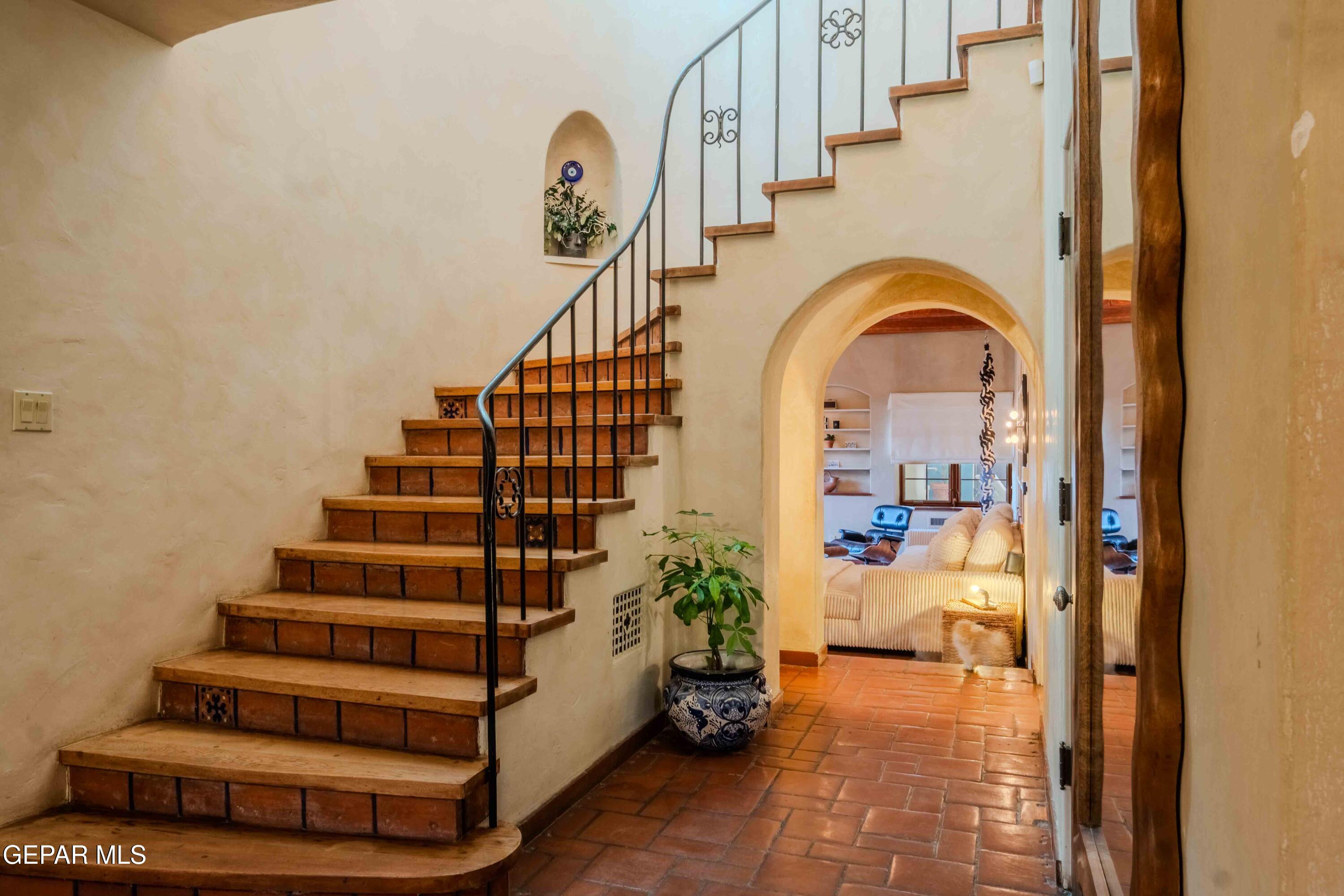 701 Rim Road El Paso, TX 79968 - Photo 7 of 54 a view of entryway and hall with wooden floor
