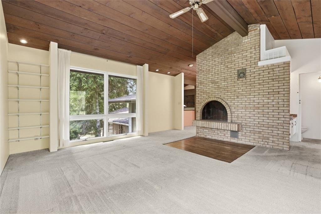 134 Meredith Drive Mars, PA 16046 - Photo 28 of 46 a view of an empty room with a fireplace and a large window