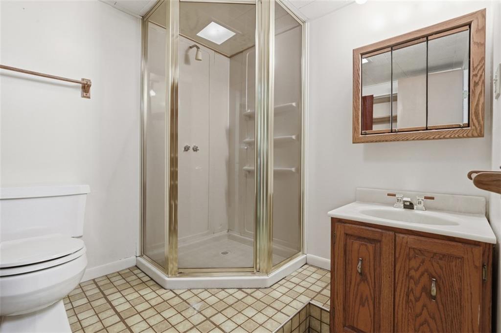 134 Meredith Drive Mars, PA 16046 - Photo 32 of 46 a bathroom with a granite countertop sink mirror and toilet