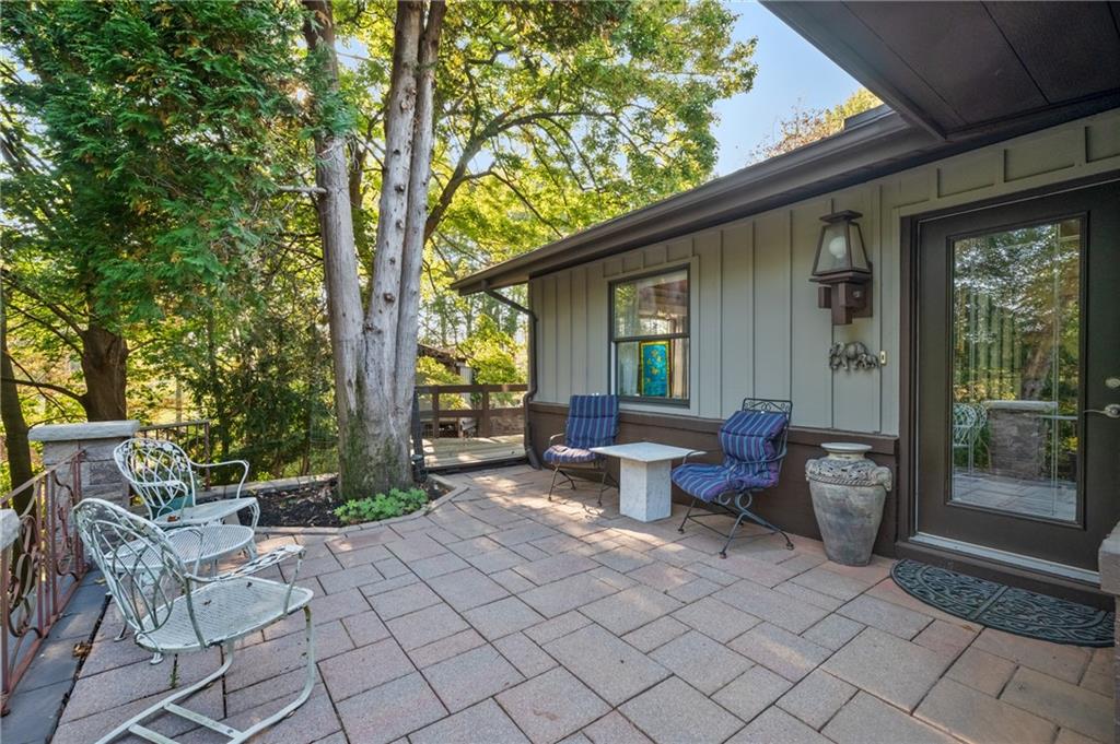 134 Meredith Drive Mars, PA 16046 - Photo 37 of 46 a view of a patio with couple of chairs and a fire pit
