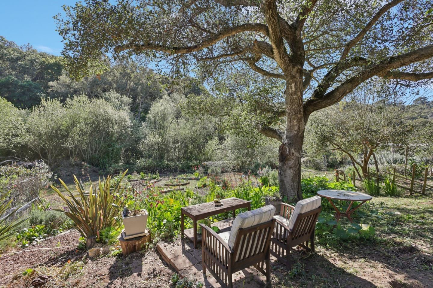 122 Strawberry Road Watsonville, CA 95076 - Photo 42 of 57 a view of backyard with a table and chairs