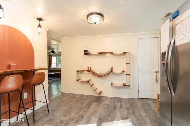 a view of kitchen with furniture and wooden floor