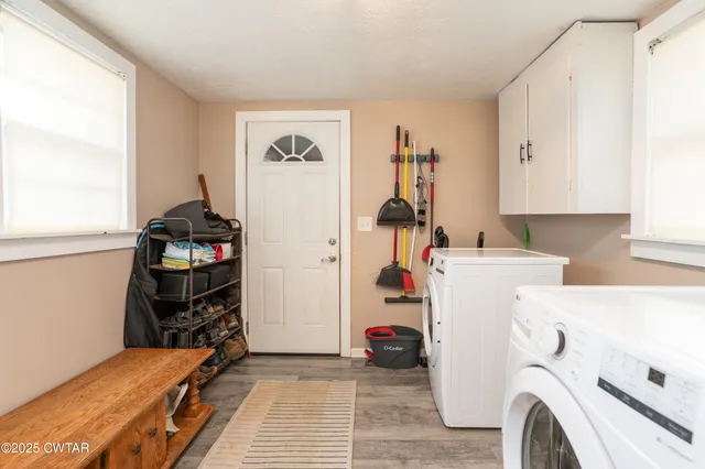 a view of storage and utility room with washer and dryer