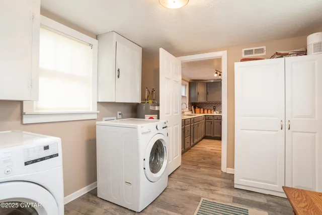 a utility room with dryer and washer