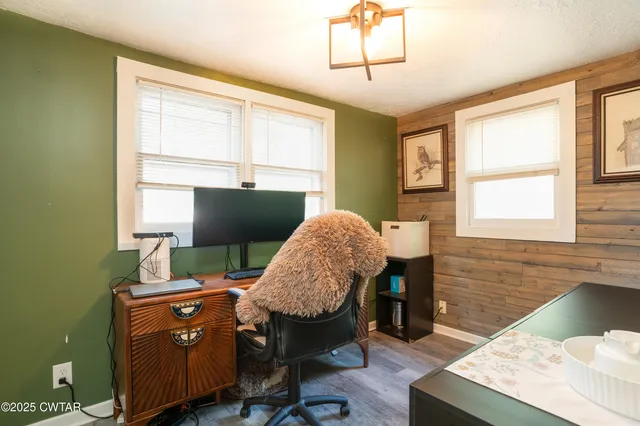 a workspace with furniture and a window