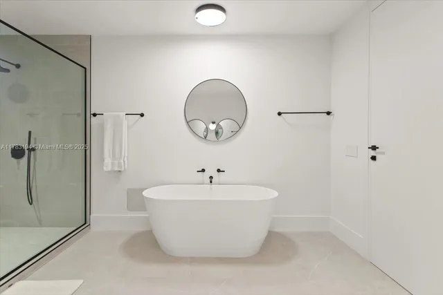 a white bath tub sitting in a bathroom
