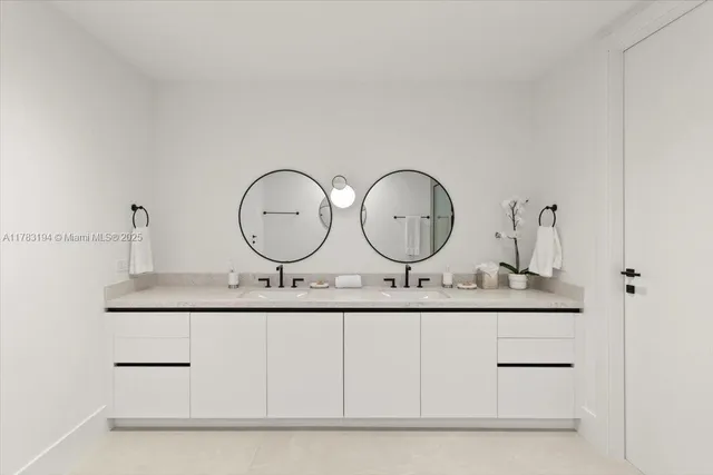 a bathroom with vanity granite and a sink