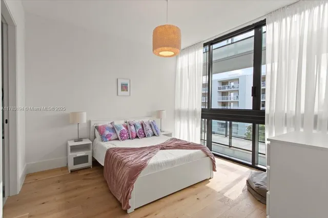 a bedroom with a bed and a view of bathroom