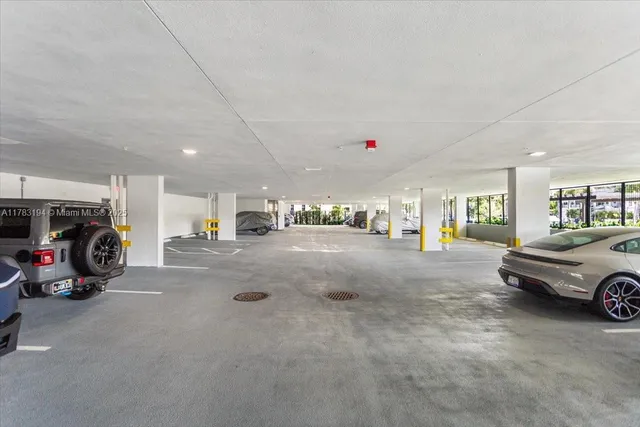 a car parked in parking area next to a building