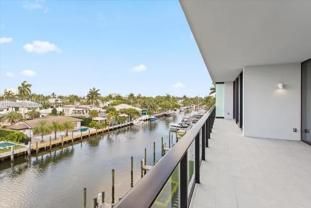 a view of a hallway with paintings on the wall