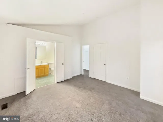 an empty room with a bathroom