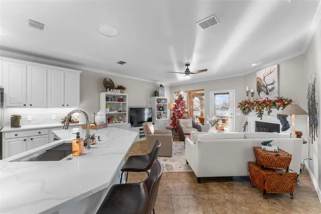 a very nice looking living room with furniture and a chandelier