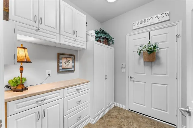 a sink with white cabinets