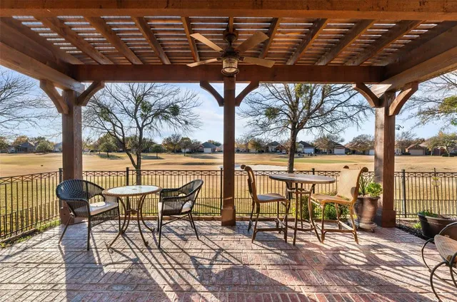 a view of chairs and table in the patio