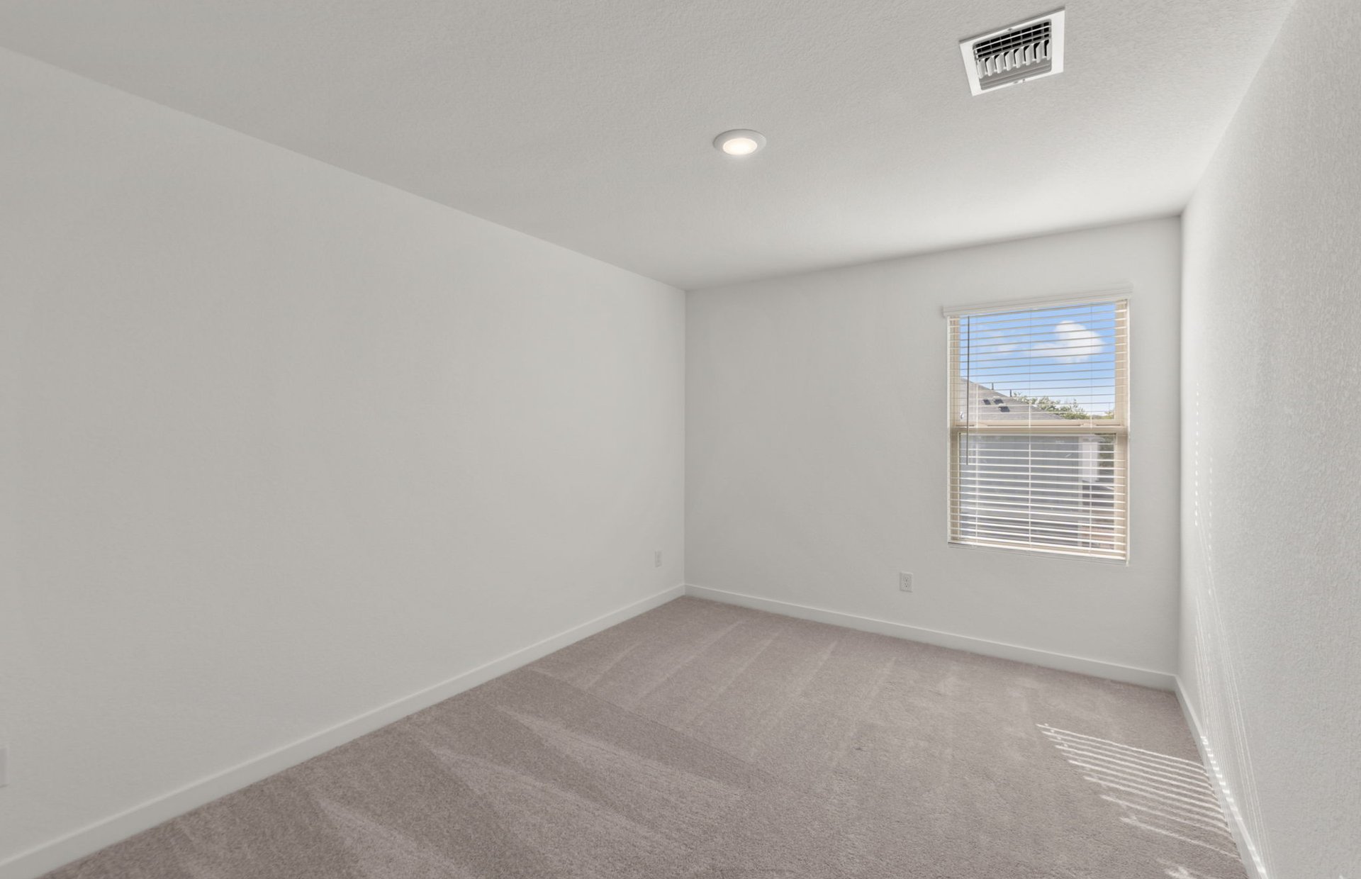 590 Rubber Tree Way Buda, TX 78610 - Photo 14 of 22 an empty room with a window