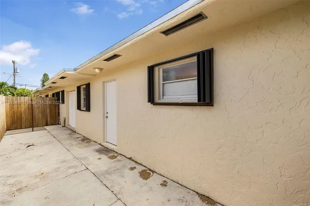 a car parked in front of a house