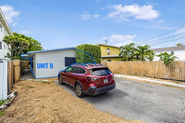 a view of a kitchen with wooden floor