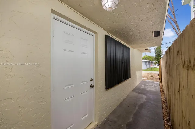 a view of a pathway both side of house