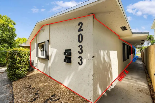 a front view of a house with white walls