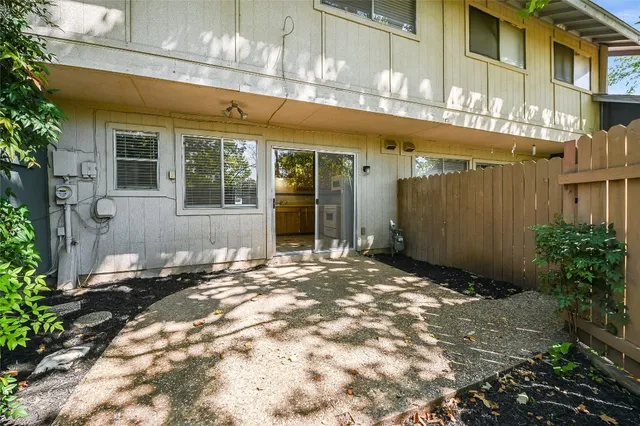 a view of a building with a yard