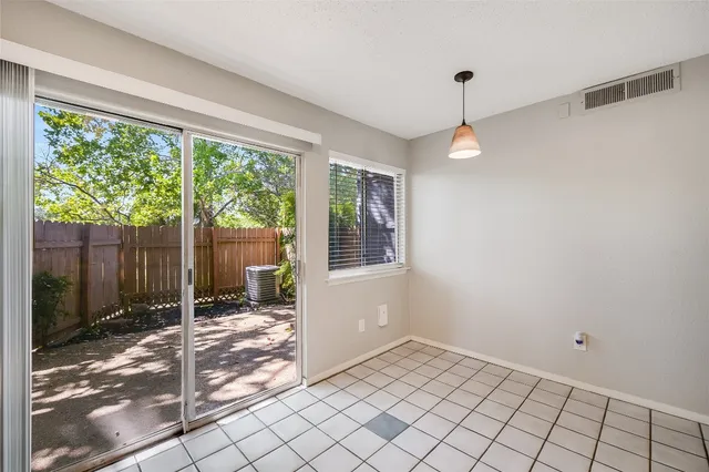a view of an empty room and window