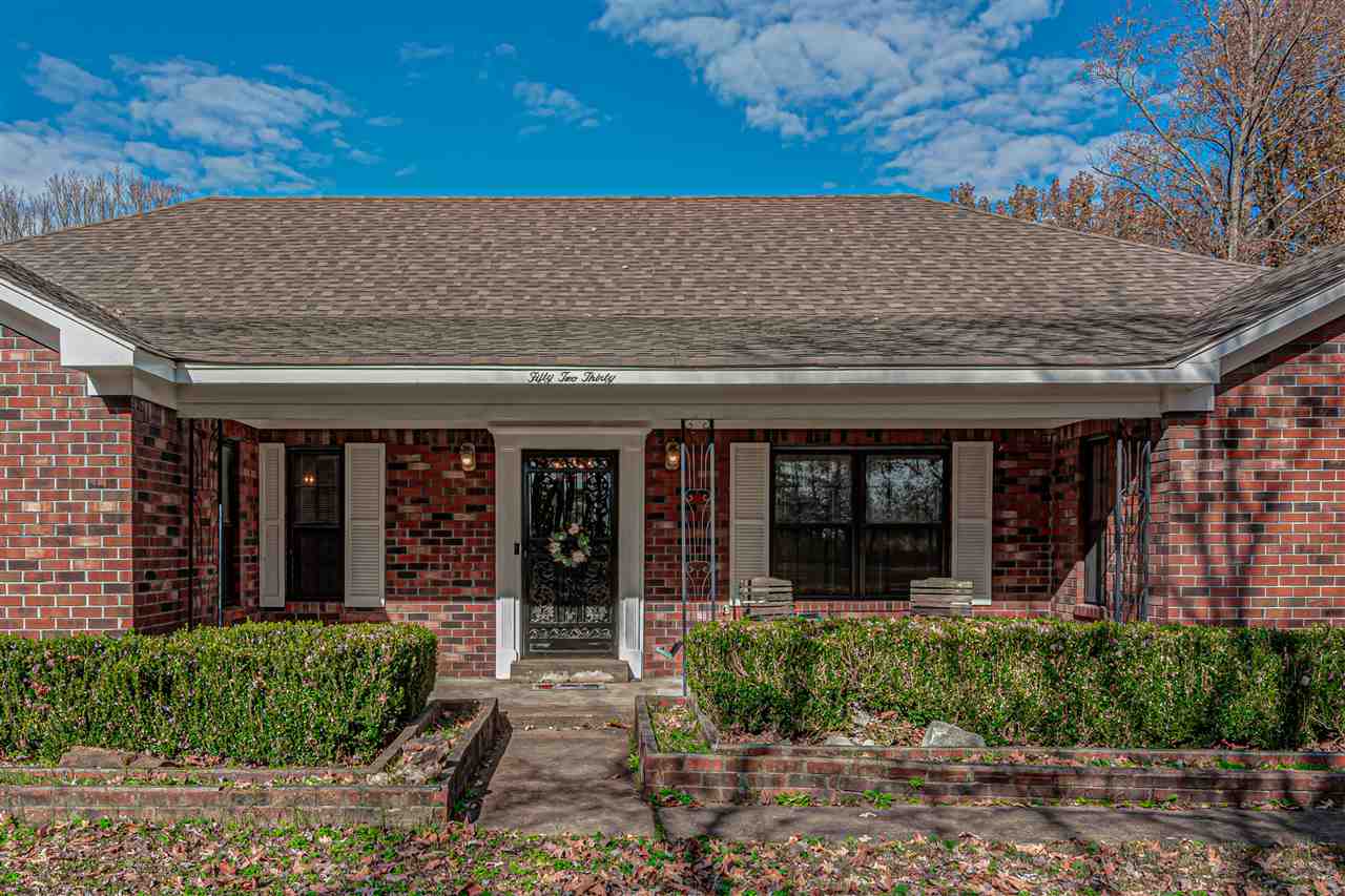 Inviting front porch with room for porch swing and small table and chairs. Enjoy nature while relaxing on your front porch. Home sits far from back from street.
