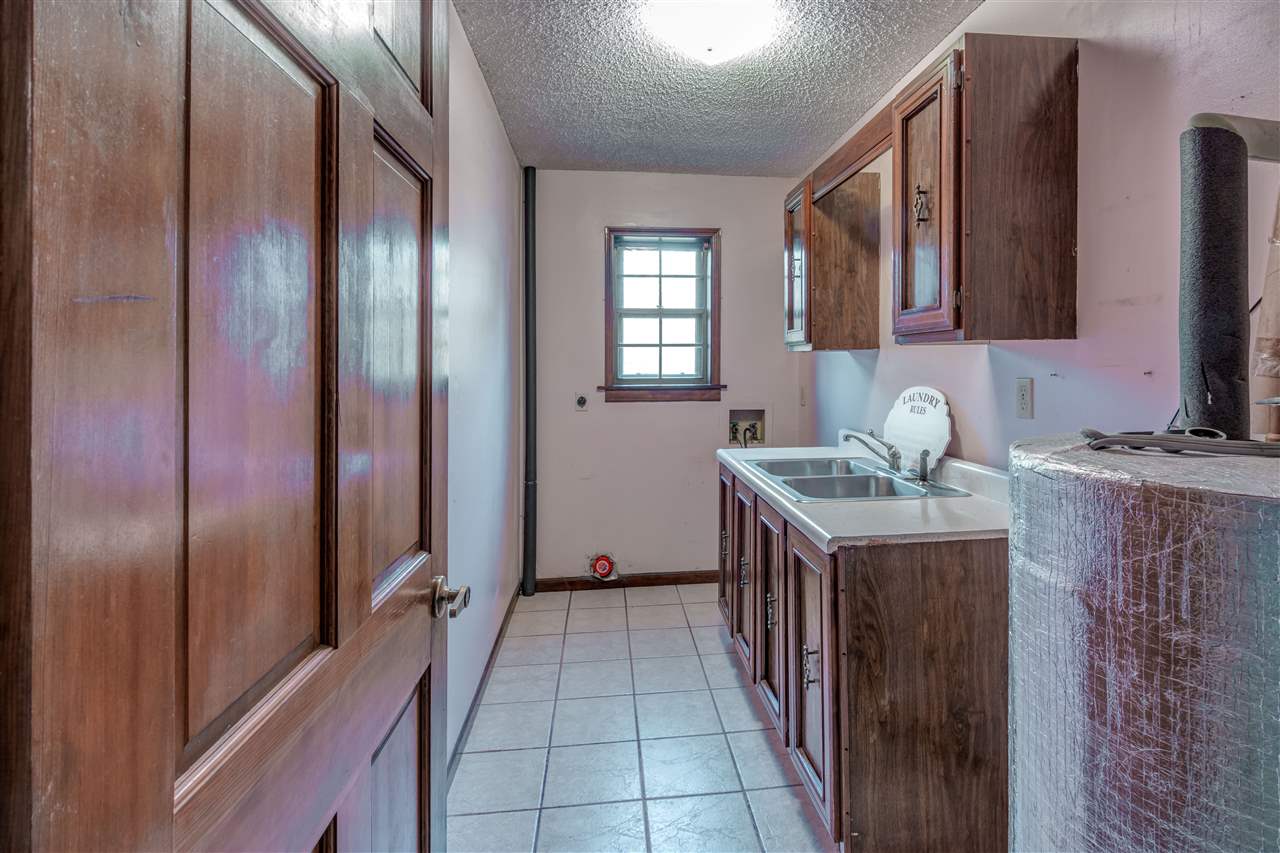5230 Bateman Road Millington, TN 38053 - Photo 9 of 22 Spacious laundry room with double sink. Hand wash your delicates and hang to dry.