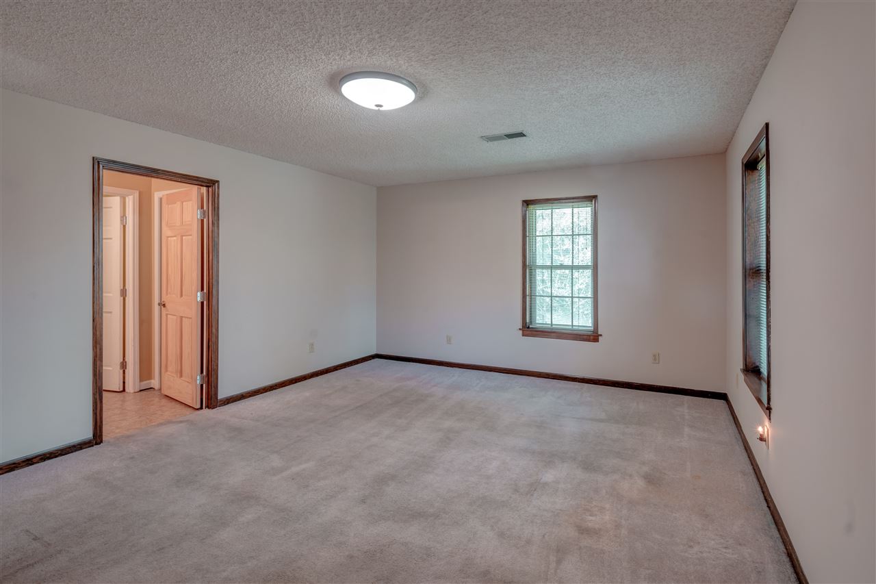 5230 Bateman Road Millington, TN 38053 - Photo 10 of 22 This master bedroom is on the first floor with private master bathroom.
