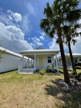 a front view of house with yard and entertaining space