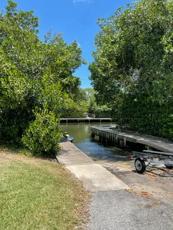 a view of a lake with a car parked in front of it