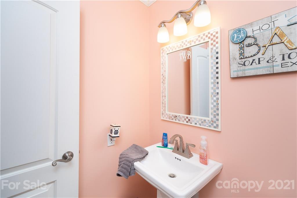 2841 Hart Road Clover, SC 29710 - Photo 17 of 26 a bathroom with a sink a mirror and a shower
