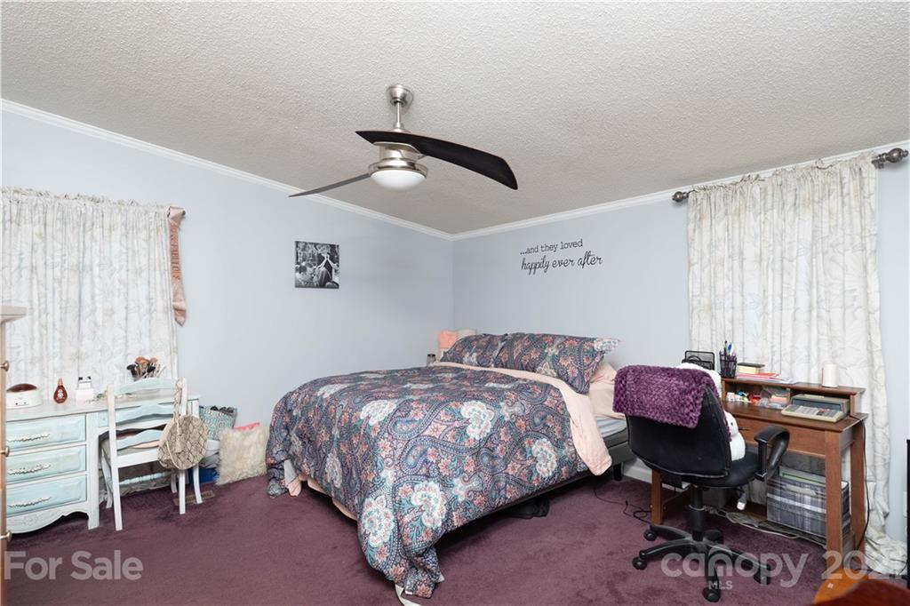 2841 Hart Road Clover, SC 29710 - Photo 21 of 26 a bedroom with a bed and a workspace