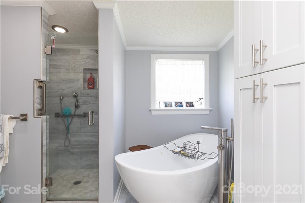 2841 Hart Road Clover, SC 29710 - Photo 23 of 26 a bathroom with a sink a shower and a mirror