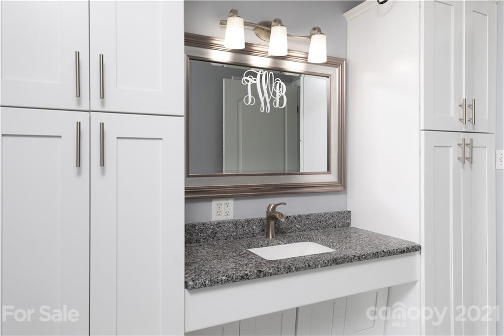 2841 Hart Road Clover, SC 29710 - Photo 24 of 26 a bathroom with a granite countertop sink and a mirror