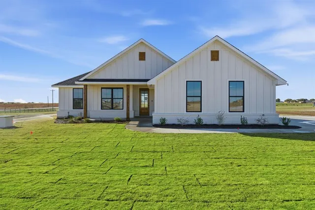 a view of a house with pool yard and outdoor seating
