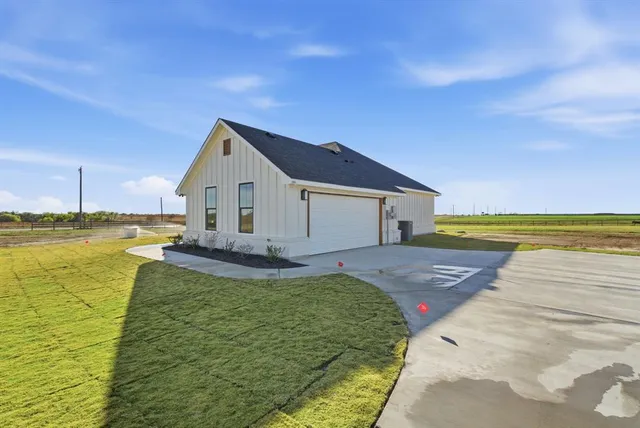 a front view of a house with swimming pool having outdoor seating